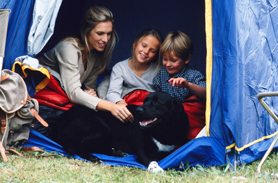 Family in tent with adopted dog